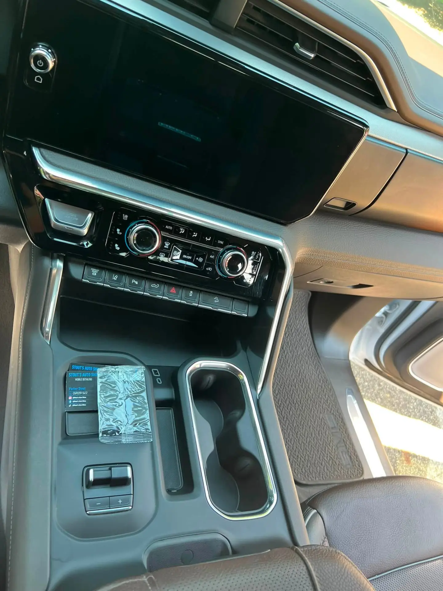 Center console and screen detailed by Stout's Auto Shine